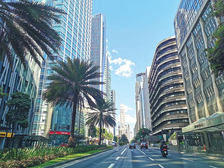 Makati's financial district looks like a ghost town as few vehicles pass after the government declared a Luzon-wide lockdown to contain Covid-19. (Photo from BusinessMirror)
